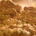 Almond croissants for sale in display case at Au Bon Pain