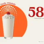 Vanilla milkshake topped with whipped cream and a cherry with text '580 calories per serving'.