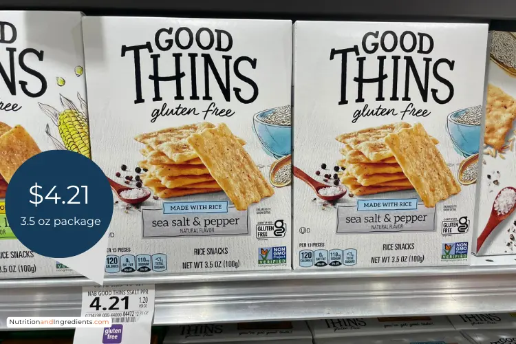 Packages of Good Thins crackers on shelf at market with current price.