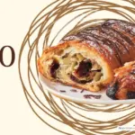 A chocolate croissant on a plate with text '470 calories'.