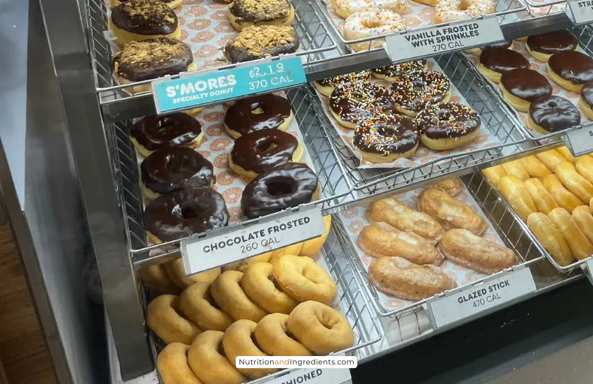 Chocolate frosted donut in display at Dunkin' Donuts.