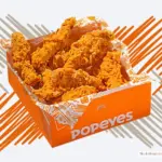 Container of chicken tenders from Popeyes restaurant.