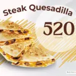 Steak and cheese quesadilla from Taco Bell with text '520 calories'.