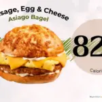 Sausage, egg, and cheese breakfast bagel sandwich from Panera Bread with text '820 calories'.