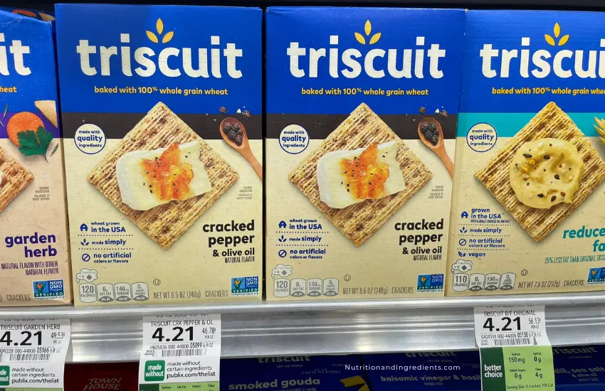 Boxes of Triscuit crackers on shelf at grocery store.