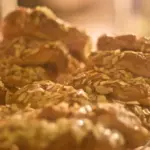 Almond croissants for sale in display case at Au Bon Pain