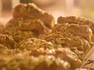 Almond croissants for sale in display case at Au Bon Pain