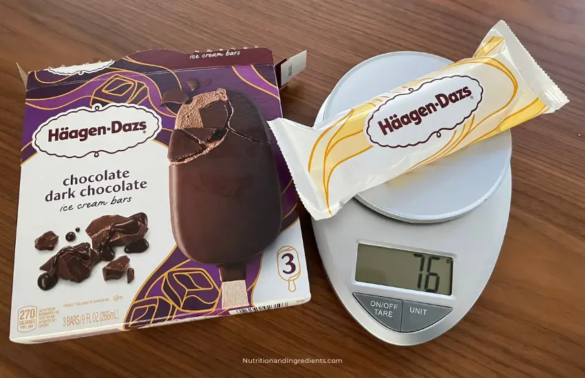 Haagen-Dazs chocolate ice cream bar on scale to illustrate serving size.