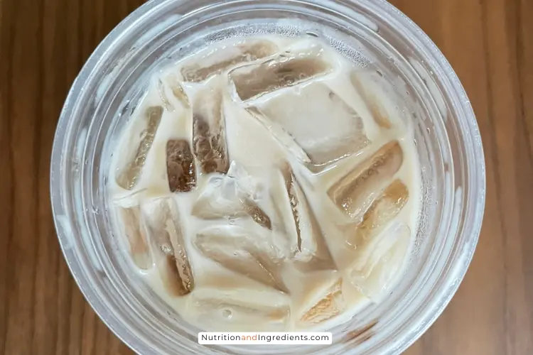 Close up view of Dunkin' iced chai latte.