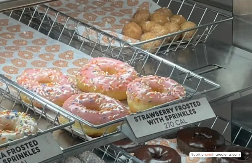 Strawberry frosted donuts on display at Dunkin' Donuts.