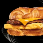 Burger King croissant breakfast sandwich with sausage, egg, and cheese.