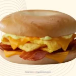 A breakfast sandwich from McDonald's with egg, bacon, cheese.