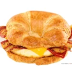 Bacon, egg and cheese breakfast sandwich on a croissant.