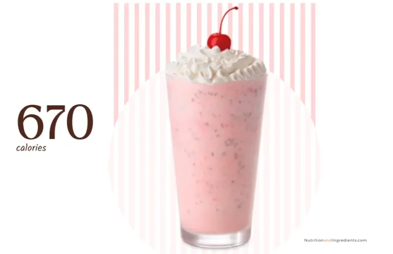 Glass filled with Chick-fil-A peppermint milkshake, whipped cream, and cherry.