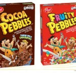 Box of Cocoa Pebbles and box of Fruity Pebbles cereal.