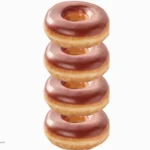 Stack of four chocolate iced donuts from Krispy Kreme.