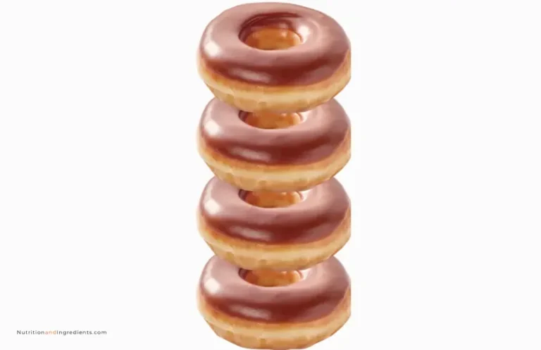 Stack of four chocolate iced donuts from Krispy Kreme.