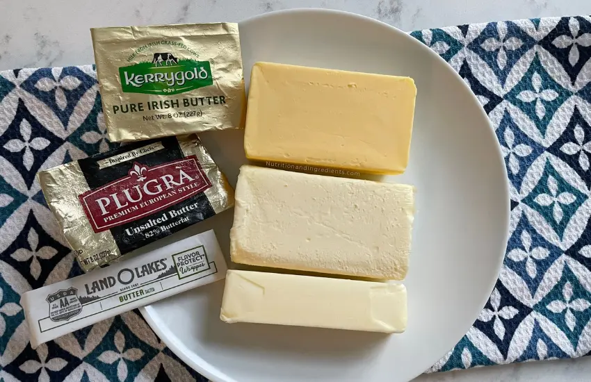 Three types of butter on a plate.