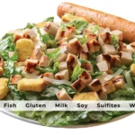 Applebee's Caesar Salad with Grilled Chicken and text list of allergens in meal.