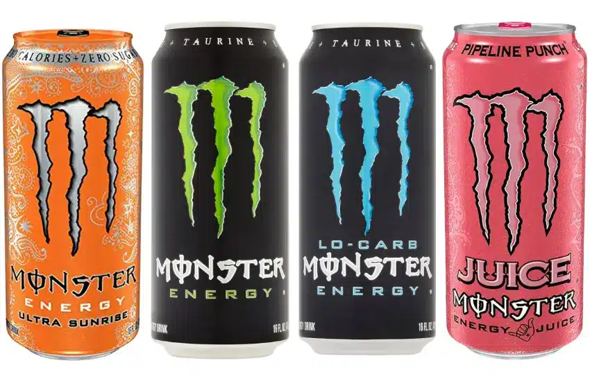 Four cans of different flavors of Monster energy drink.