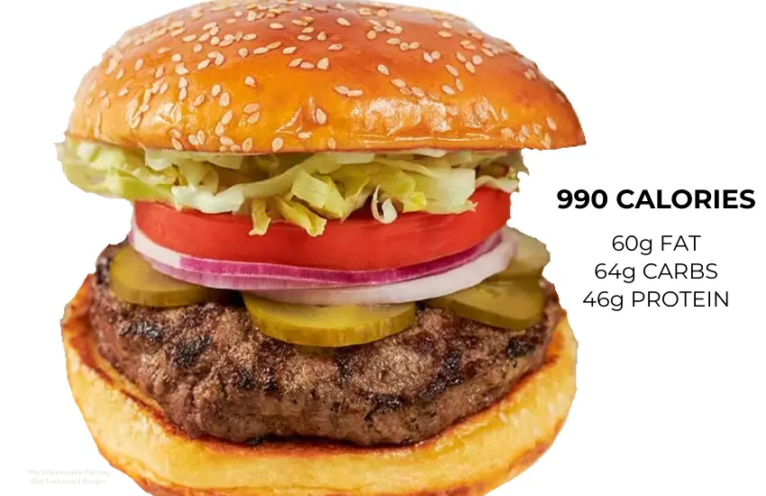 Hamburger with lettuce, tomato, onions, pickles.