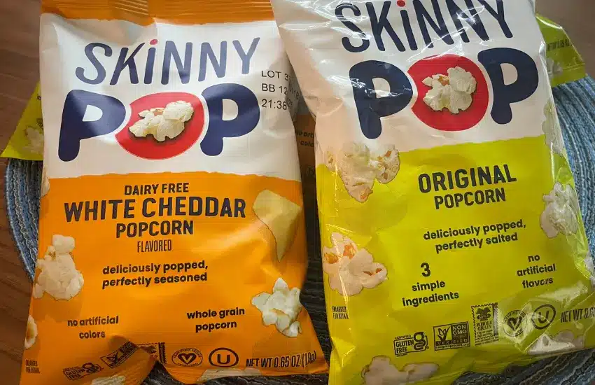 Two bags of SkinnyPop popcorn snacks.